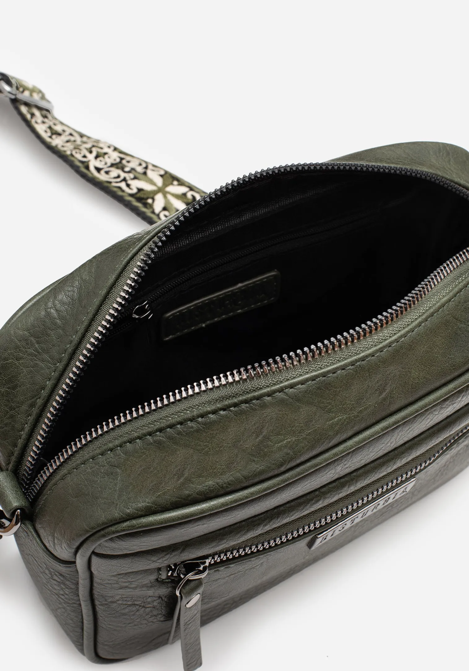 Portent Debossed Zip Front Crossbody Bag